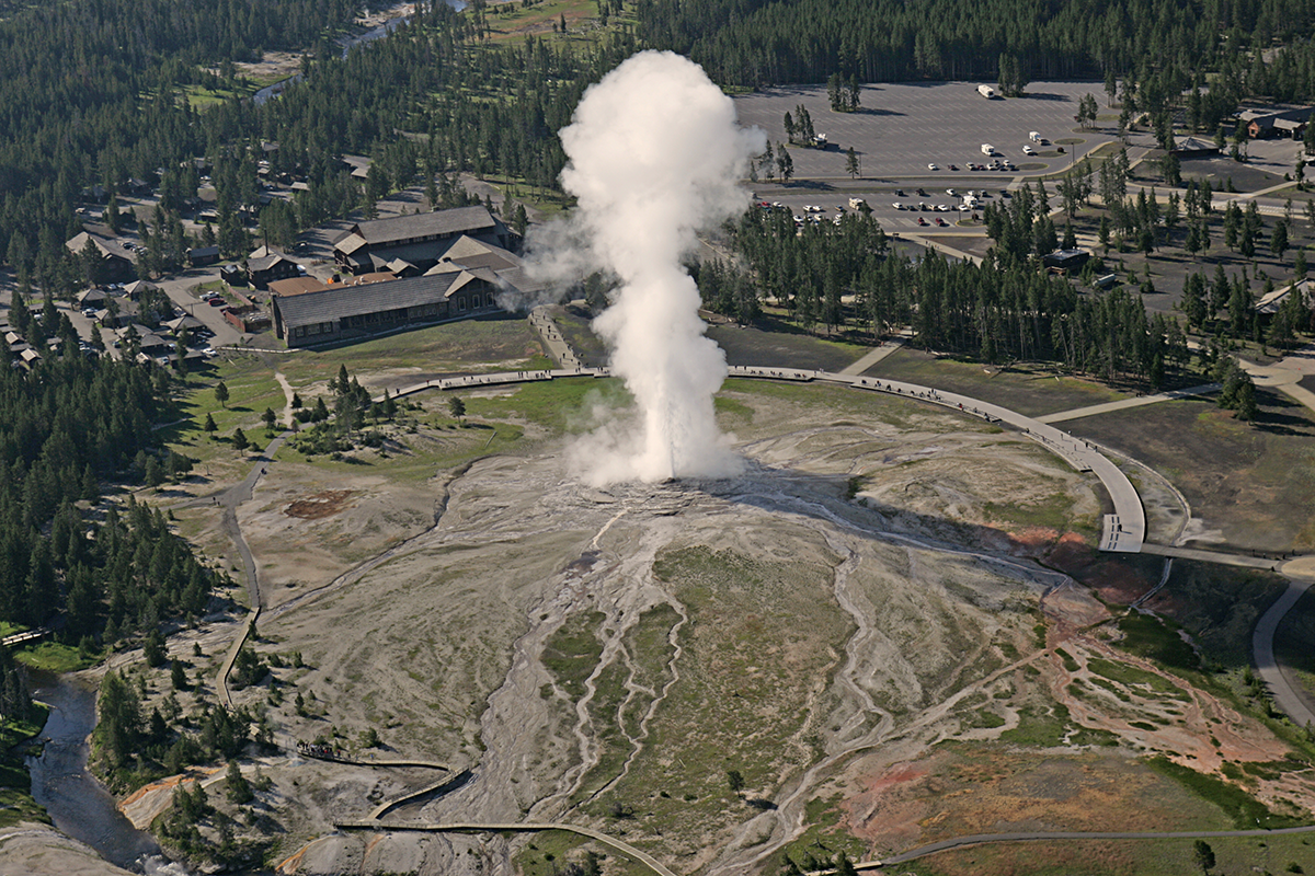 Old Faithful geyser erupting in Yellowstone National Park